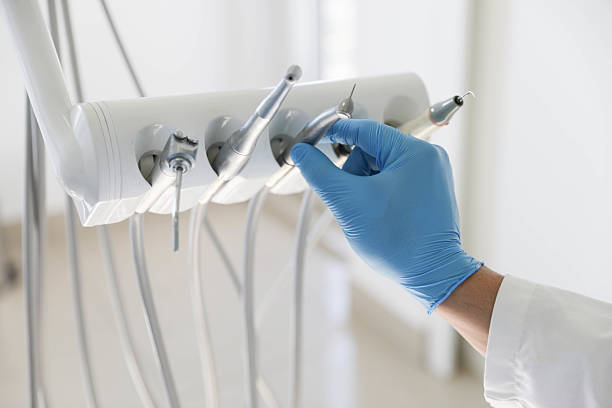 Professional Tooth Extraction technician working in Ferrysburg, MI